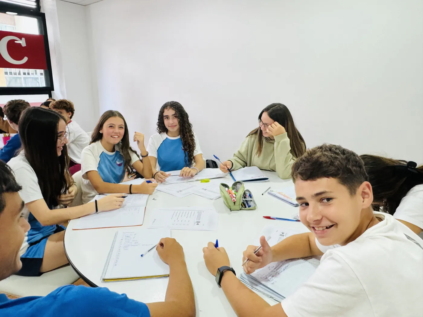 Primary pupils in a learning activity around a table